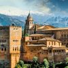 Visit Granada and see the Alhambra with snow-capped mountains behind