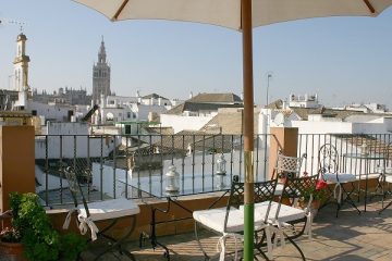 View over Santa Cruz to La Giralda from a lookout on hotel terrace in Seville