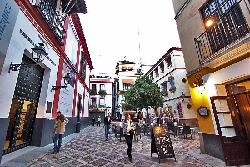 Travel to Seville and enjoy a coffee on one if the city plazas