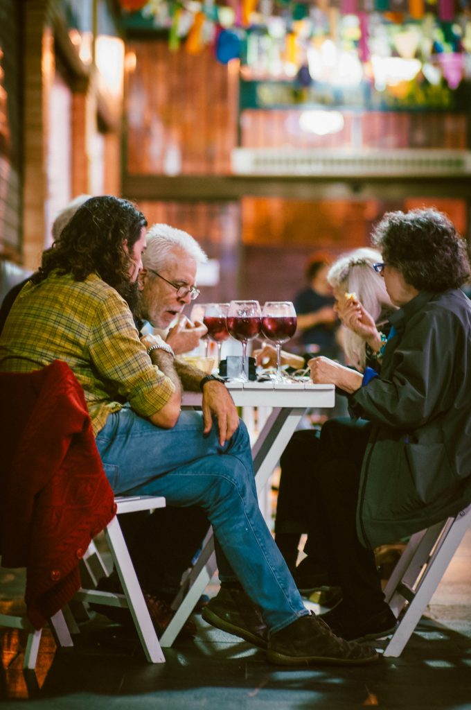 People on a tapas tour, dining outside with sangria and tapas