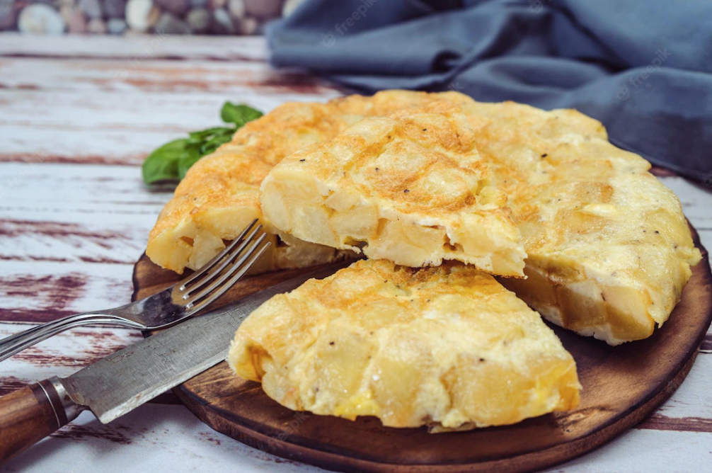 Spanish Potato Tortilla, on a wooden board. 