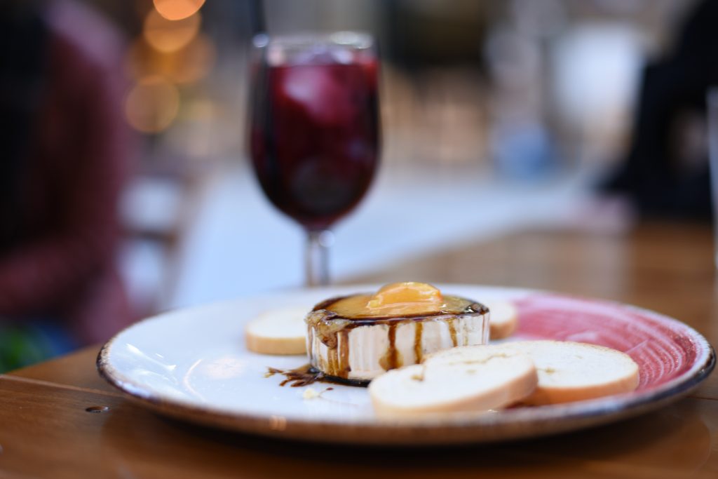 Melted goats cheese with marmalade and balsamic vinegar served with crostini and sangria.