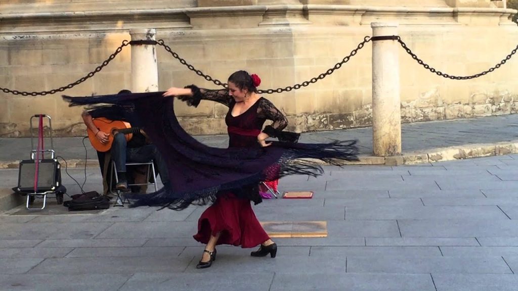 A bailaora performing a flamenco dance show