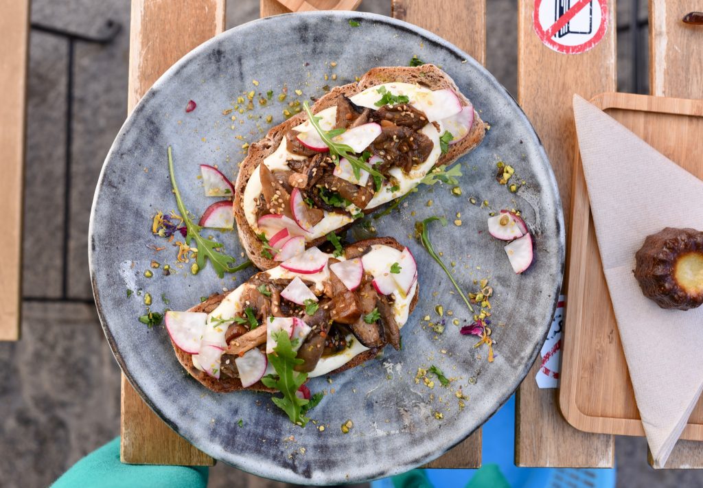 Mushroom and miso toast with radish and rocket